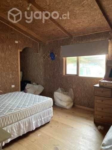 Se vende terreno con cabaña