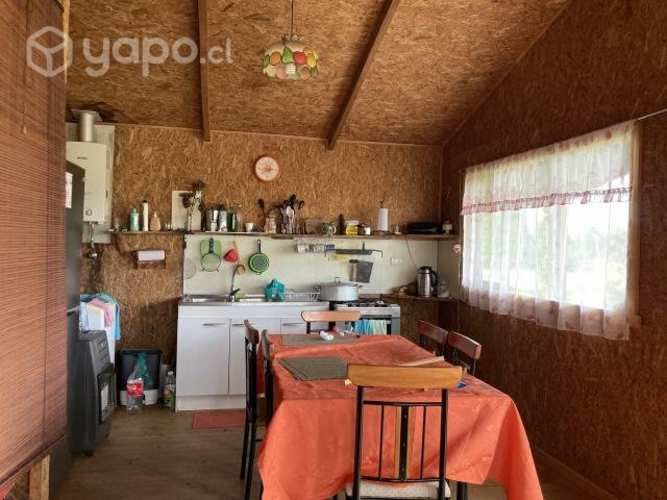 Se vende terreno con cabaña