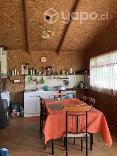 Se vende terreno con cabaña
