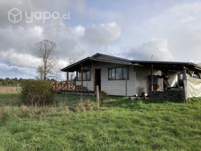 Se vende terreno con cabaña