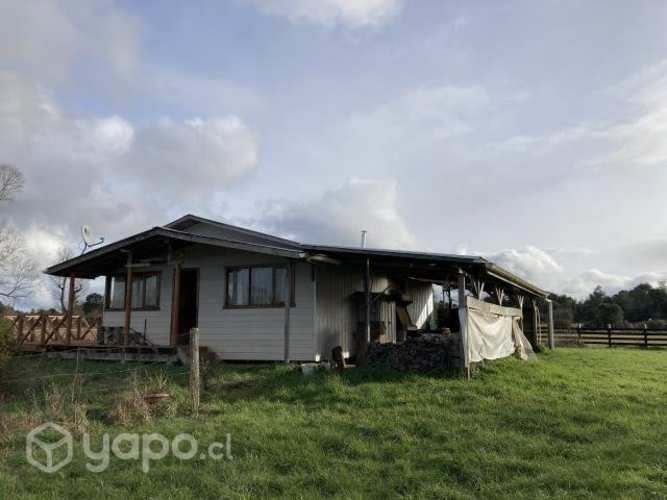 Se vende terreno con cabaña