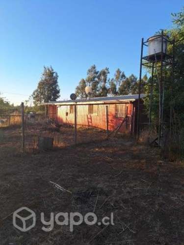 Parcela con casa habitación