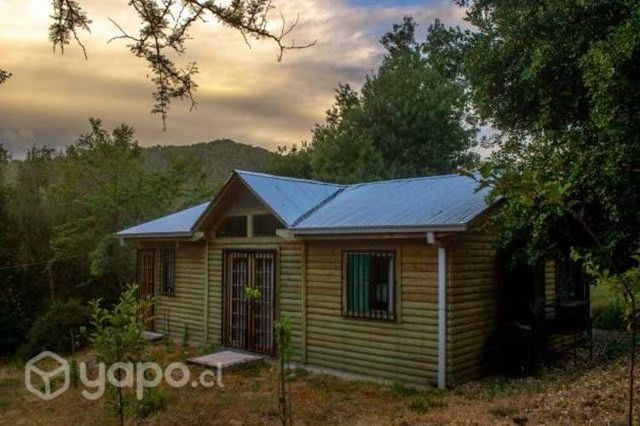 Parcela con tres cabañas para inversión