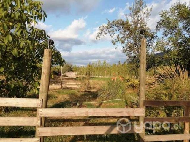 Terreno con casa, cabañas y piscinas