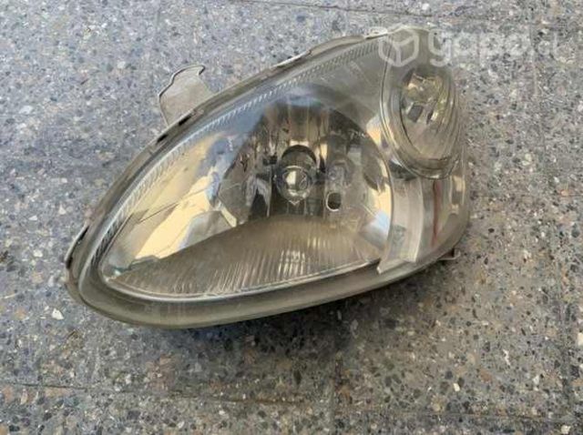 Foco original lado piloto Yaris 2004