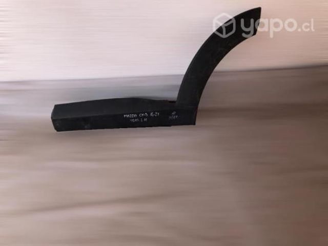 Moldura de rueda tras lh mazda cx