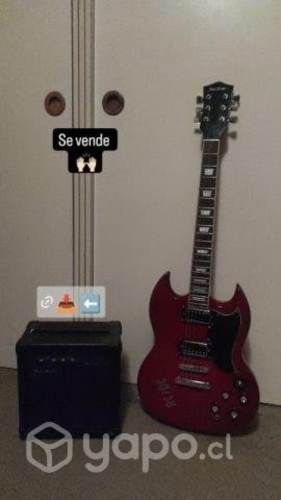 Guitarra electrica con amplificador