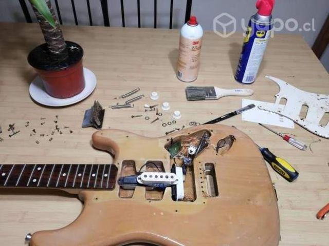 Reparación y calibración de. Guitarra electrica