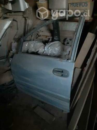 Puerta chofer chrysler caravan 97-01