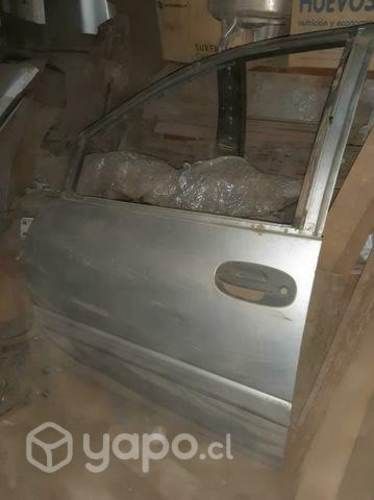 Puerta chofer chrysler caravan 97-01