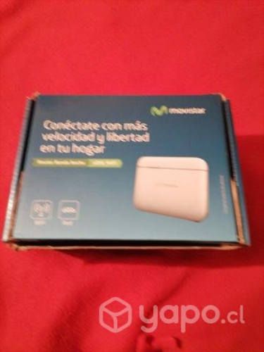 Un router con todos sus accesorios y su caja.