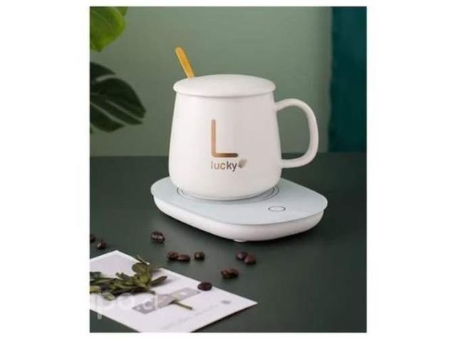 Taza hervidora color rosada y blanca