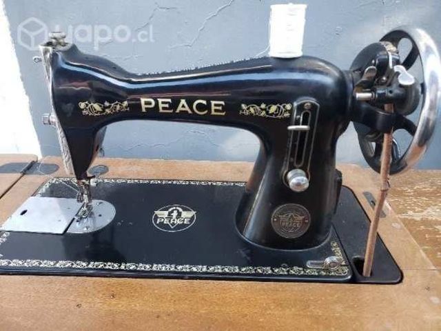 Antigua maquina de coser Peace excelente