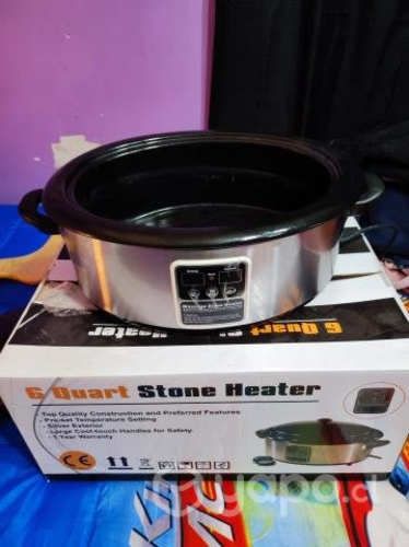 Olla con piedras termales