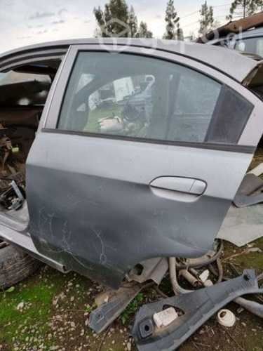 Puerta trasera izquierda chevrolet sail año 2013