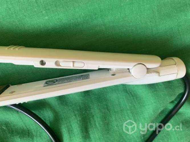 Alisadora de pelo funcionando en perfecto estado