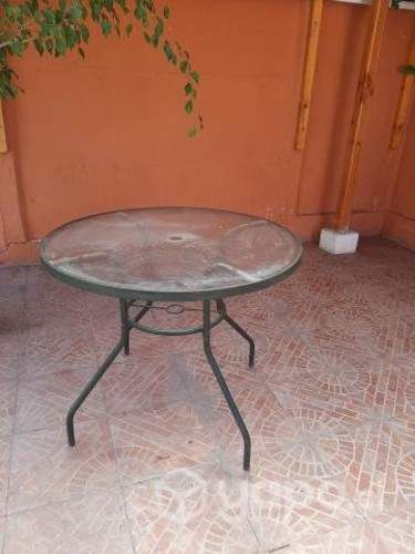Mesa redonda de terraza usada