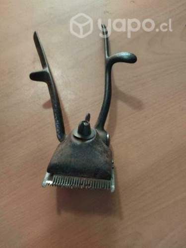 Máquina manual para cortar cabello.