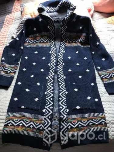 Chaleca de lana azul con diseños casi nueva