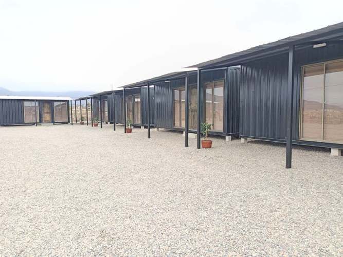 TERRENO CONSTRUCCION TERRENO DE 3298mt2 urbanizado con agua y luz Hermosa vista despejada a la Bahía de la Herradura, con 10 departamentos amoblados para arriendo.