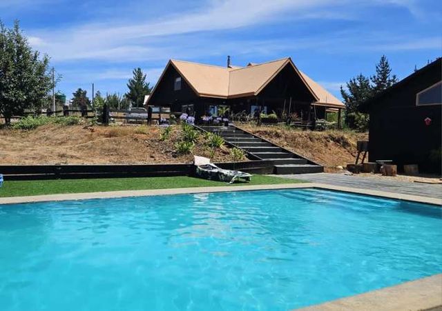 Parcela con casa, quincho y piscina, sector San Nicolas, Florida. $