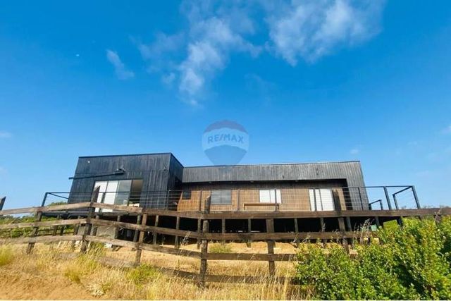 Parcela 5.000 m2 con casa amoblada, negociable