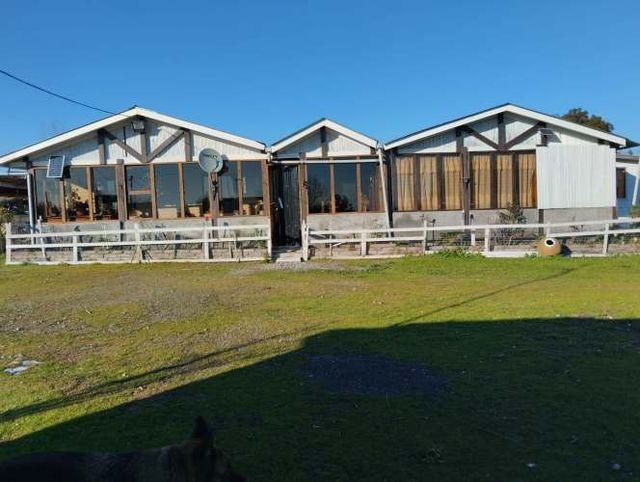 OPORTUNIDAD UNICA!!!  PARCELA de 6400 m2; dos casas y taller mecánico