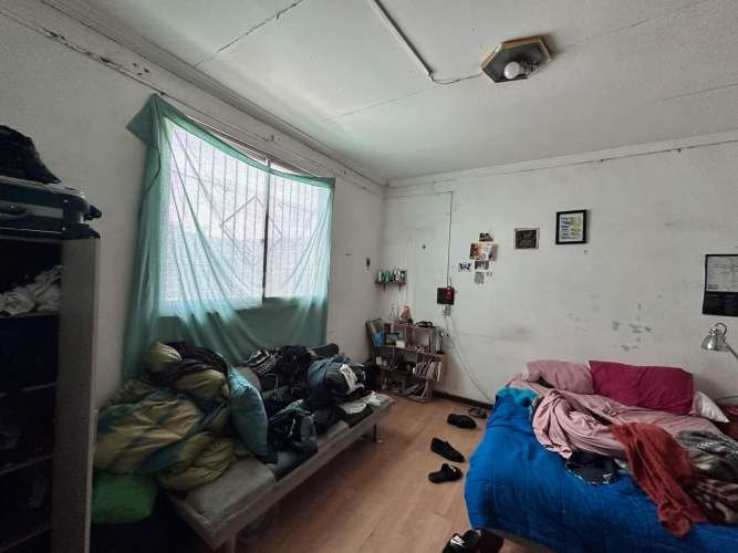 Amplio terreno con casa en Juana Quinel