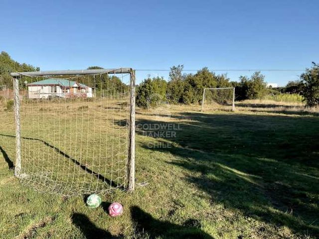 Rebajada! Terreno con Casa al lado Parque Empresarial.
