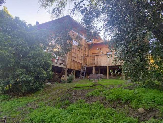 Parcela con hermosa casa de madera 100% nativa. 4 d.