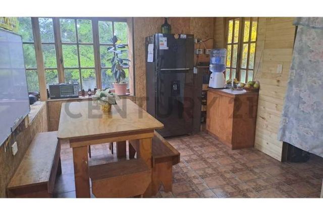 GRAN BODEGA Y DOS CABAÑAS EN PARCELA 12.000 M2 A 10 KM DEL CENTRO DE PUCON