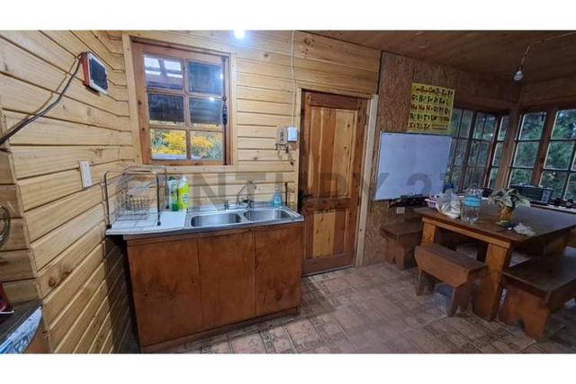 GRAN BODEGA Y DOS CABAÑAS EN PARCELA 12.000 M2 A 10 KM DEL CENTRO DE PUCON