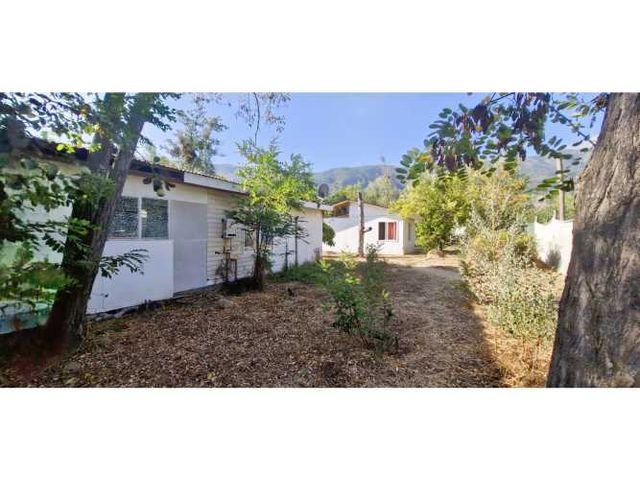 Venta de sitio de 1.624 m2., con 2 casas y una cabaña, en Olmué. 110 M$